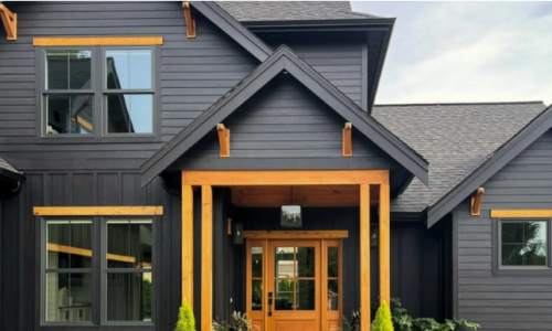 “Modern black custom siding with natural wood accents on a contemporary home.”