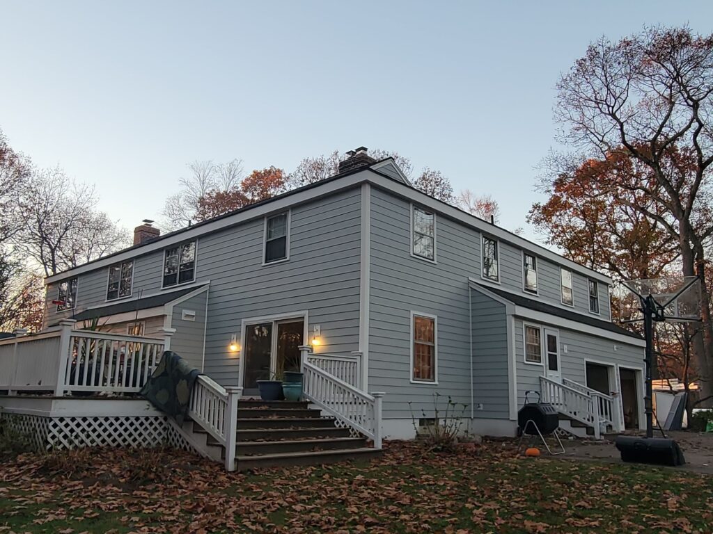 "Completed vinyl siding installation on a two-story home in Connecticut by MJT Siding."