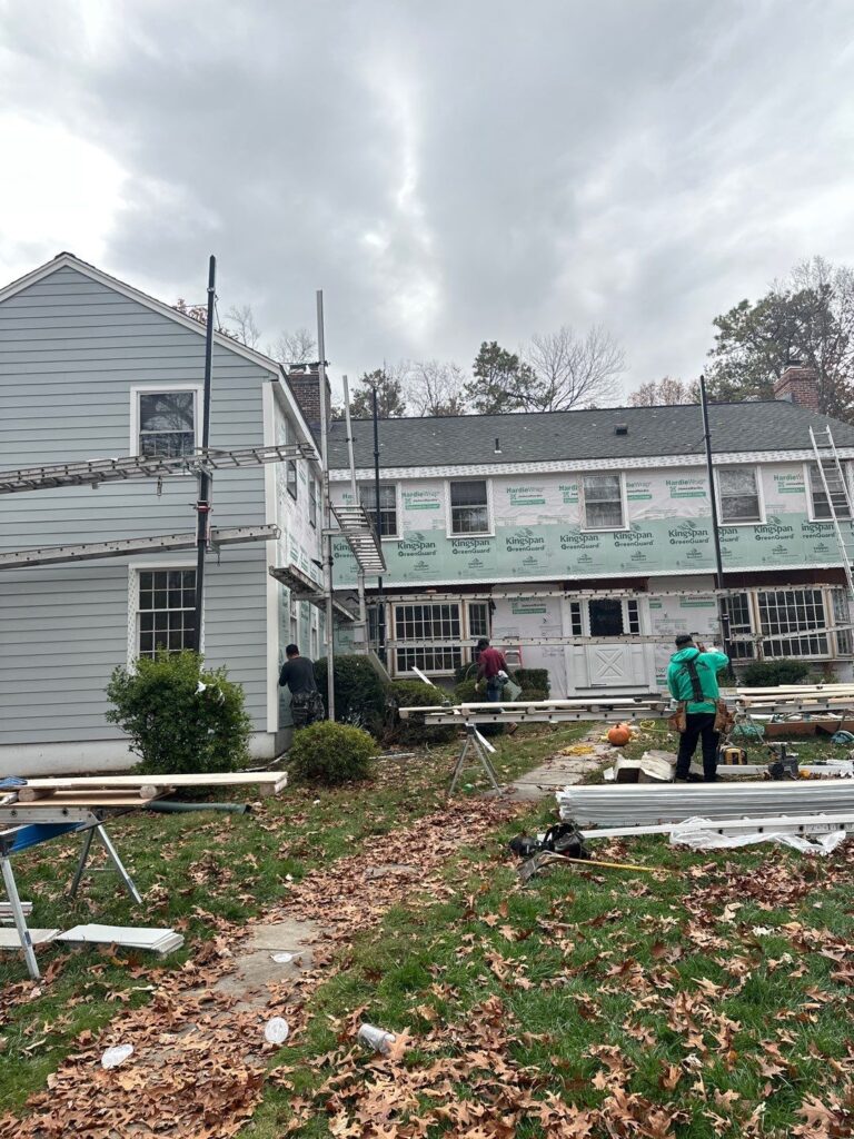 "MJT Siding crew installing new siding on a home in Columbia, Connecticut during full exterior renovation.