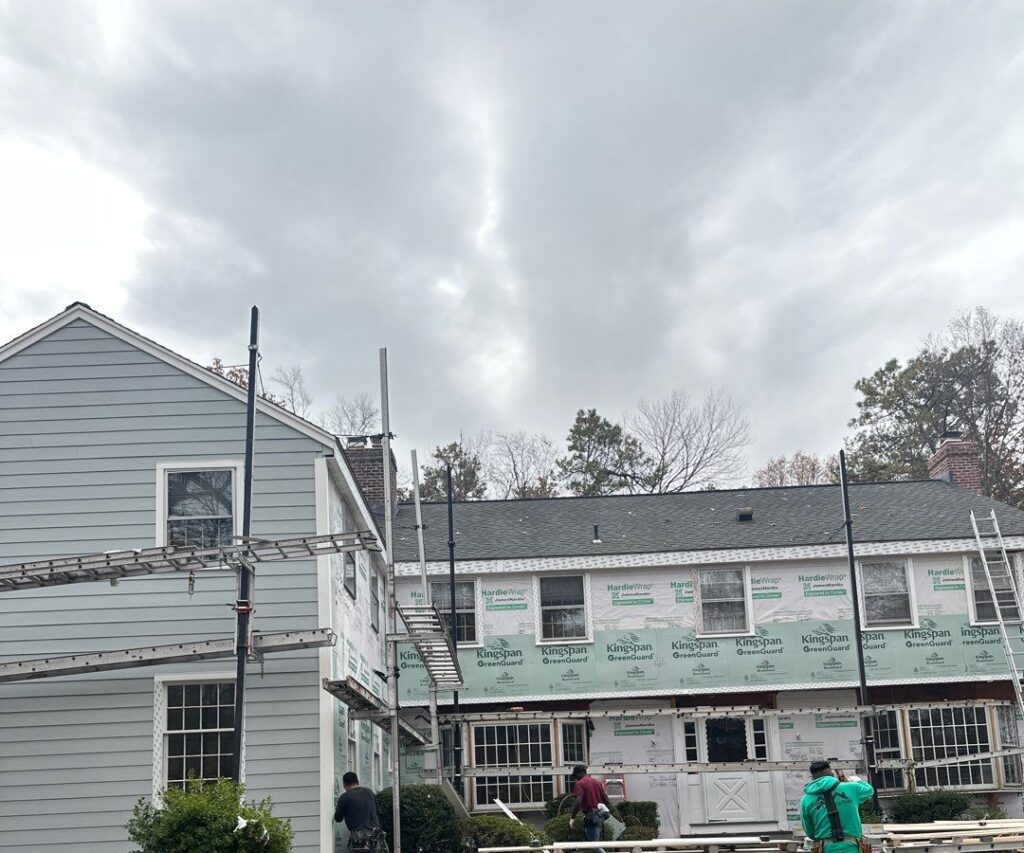 "MJT Siding crew installing new siding on a home in Columbia, Connecticut during full exterior renovation.